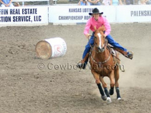 This barrel racer has just knocked down the first barrel.