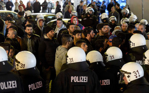 Kurdish people face German riot police as they demonstrate in ...