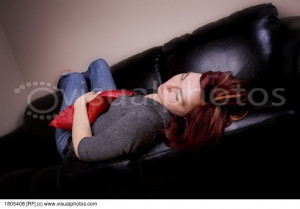 young_woman_sleeping_on_the_couch_1805408.jpg