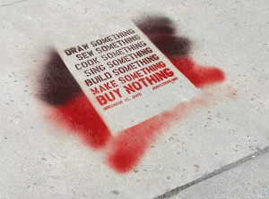 An Adbusters quote spray painted onto a sidewalk. (Flickr / resa ...