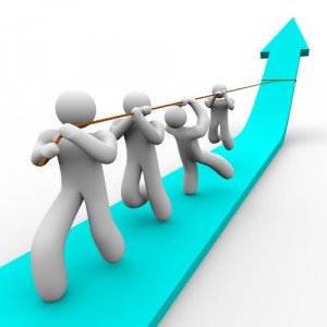 Team pulling themselves up with management training