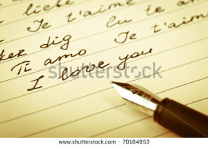 love phrases on the paper with a pen - stock photo