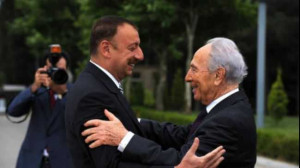 Azeri President Ilham Aliyev (L) embraces Israeli President Shimon ...