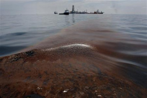 Dispersed oil floats on the surface of the Gulf of Mexico waters close ...