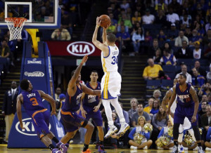 Stephen Curry puts up a three point shot in the second half. The ...