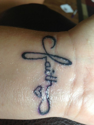 Love Faith, cross tattoo on her wrist. The small heart in tattoo made ...