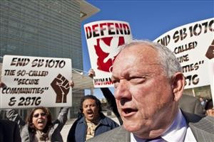 Protesters gather around Arizona State Sen. Russell Pearce, R-Mesa ...