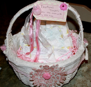 wicker basket, address labels, newborn diapers, ribbon and ...