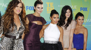 (2nd R) pose with their sisters Khloe Kardashian (L), Kim Kardashian ...