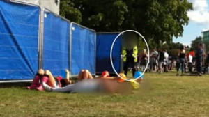 Four teenage girls lay flat on their backs consuming laughing gas from ...