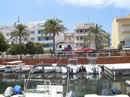 Cala Bona beach in Summer Harbour view from the Boat Ticket Office