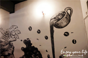 Black and white painting on the wall . Super artistic and coffee feel ...