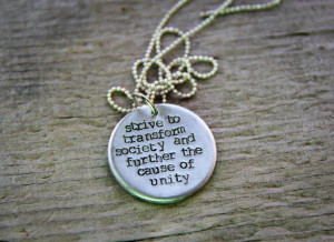 ... society and further the cause of unity. Hand stamped Bahá'í quote