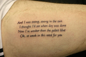 Awful Poem Tattoo On Biceps