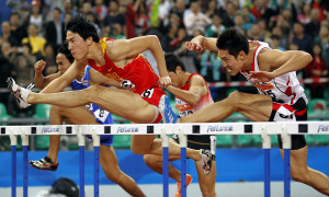 china s liu xiang front l competes during the men s 110m hurdles final ...