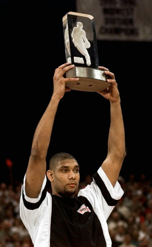 San Antonio Spurs forward Tim Duncan holds up his NBA Rookie of the ...