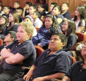 Fifth-graders react as they watch real photos of a developing fetus ...
