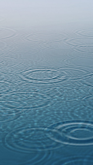 Raindrops-Falling-Into-The-Water-540x960.jpg