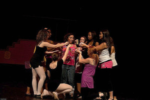 The dancers teasing Sam Bruccoliere (Mabel) with food in 