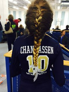 French Braid with a small bow. great for volleyball!(: More