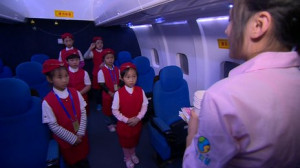 Young girls dressed up as flight attendants at the 