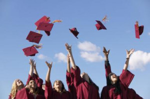 Line of Female Students Throwing Their Mortar Boards in the Air at ...