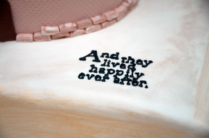 Frosted letters spell the happy ending on a fairy-tale cake.