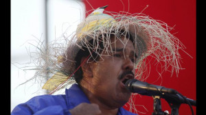 Venezuela's acting President Nicolas Maduro wears a farm worker's hat ...