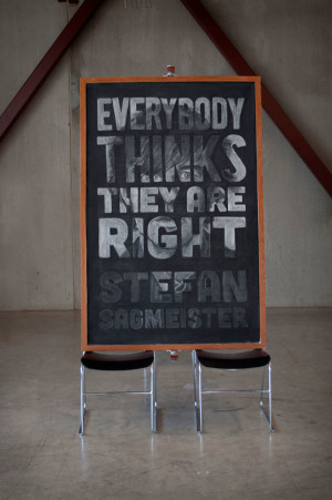 Students covertly design inspirational quotes on class chalkboard