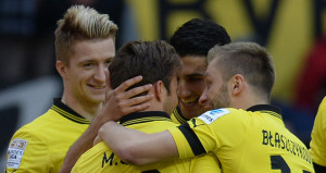 Marco Reus is mobbed after netting the opener