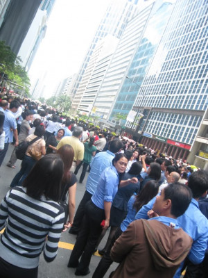 As the parade drew near Ayala Avenue, office workers in Makati trooped ...