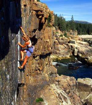 Liz Dunn-Tierney rock climbing at Otter Cliffs, Acadia National Park ...