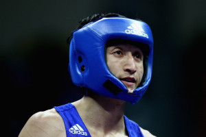 Gold Medalist Zou Shiming of Chinapetes against Amnat Ruenroeng