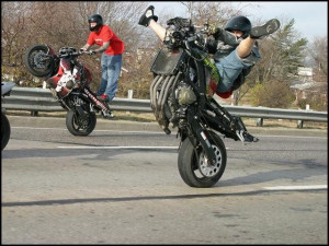 STRANGE MOTORCYCLE 'WHEELIE' FUN - WHERE'S THE FRONT WHEEL?