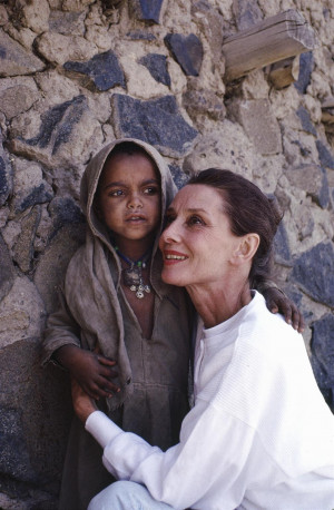 unicef:UNICEF Goodwill Ambassador Audrey Hepburn hugs a small girl who ...
