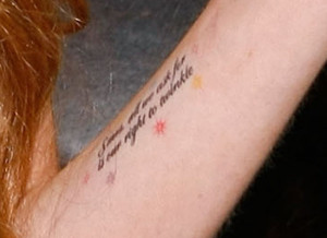 Lindsay Lohan's forearm is decorated with coloured sunbursts ...