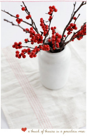 Red berries in white vase/ pitcher. Simple Winter/ Christmas decor.