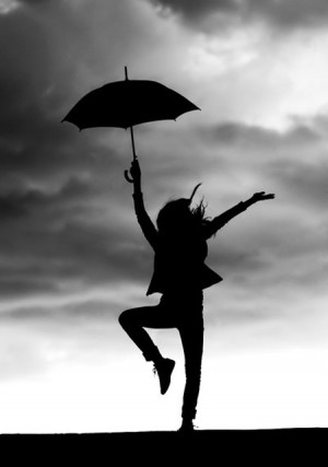 girl dancing and feel the gentle kiss of the rain.