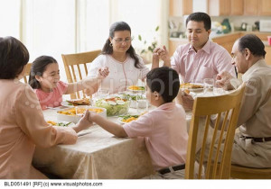 Family Praying at Dinner