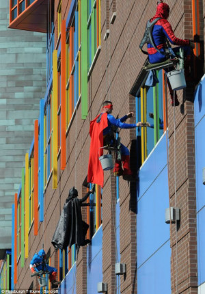 ... dress up as superheroes to cheer up patients at a children's hospital