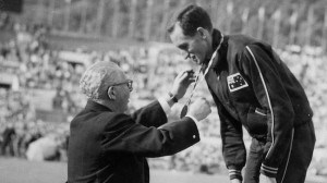 Herb Elliott receives his gold medal from Hugh Weir Australian member