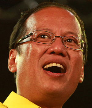 Filipino presidential candidate Benigno 'Noynoy' Aquino III raises the ...