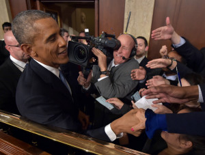 President Barack Obama shakes hands after delivering the State of the ...