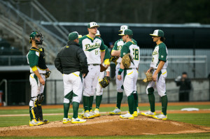 baseball players congregate on the pitchers mount between innings ...