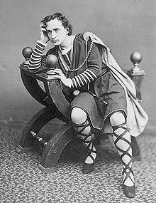 The American actor Edwin Booth as Hamlet , seated in a curule chair c ...