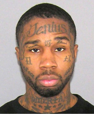 Gang member with multiple face tattoos