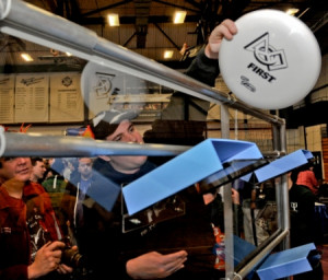 FIRST Robotics Competition team member holding this season’s game ...