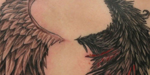 Amazing Winged Sad Angel Tattoo