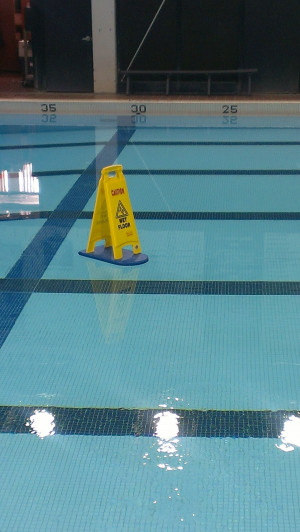 Funny picture #6333 tags: wet floor swimming pool sign float floating