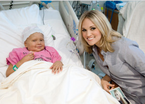 Carrie visits a St. Jude patient for St. Jude Kids seminar